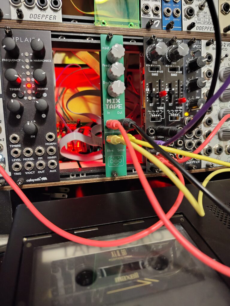 MixTape prototype mounted in a Eurorack with part of a Marantz PMD221 in the foreground.